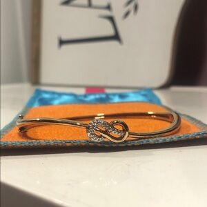 Rose Gold plated over Sterling Infinity Knot Bangle Bracelet with diamond accent